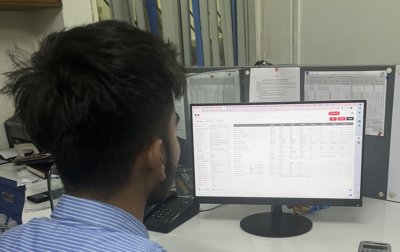 Employee using the ValCal Sizing Software developed by IVPL